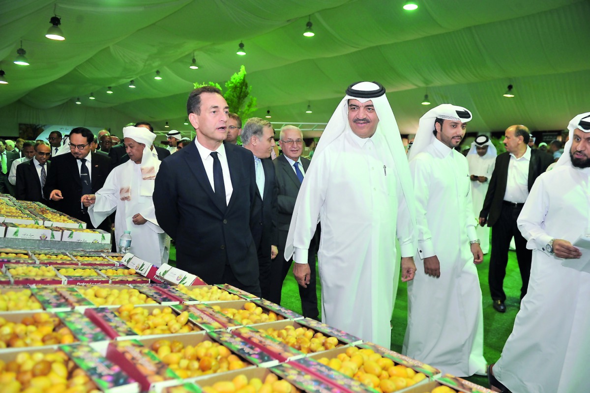 Minister of Municipality and Environment, H E Mohammed bin Abdullah Al Rumaihi, visiting the stalls after inaugurating the second Local Date Festival at Souq Waqif, yesterday. Pic: Baher Amin / The Peninsula