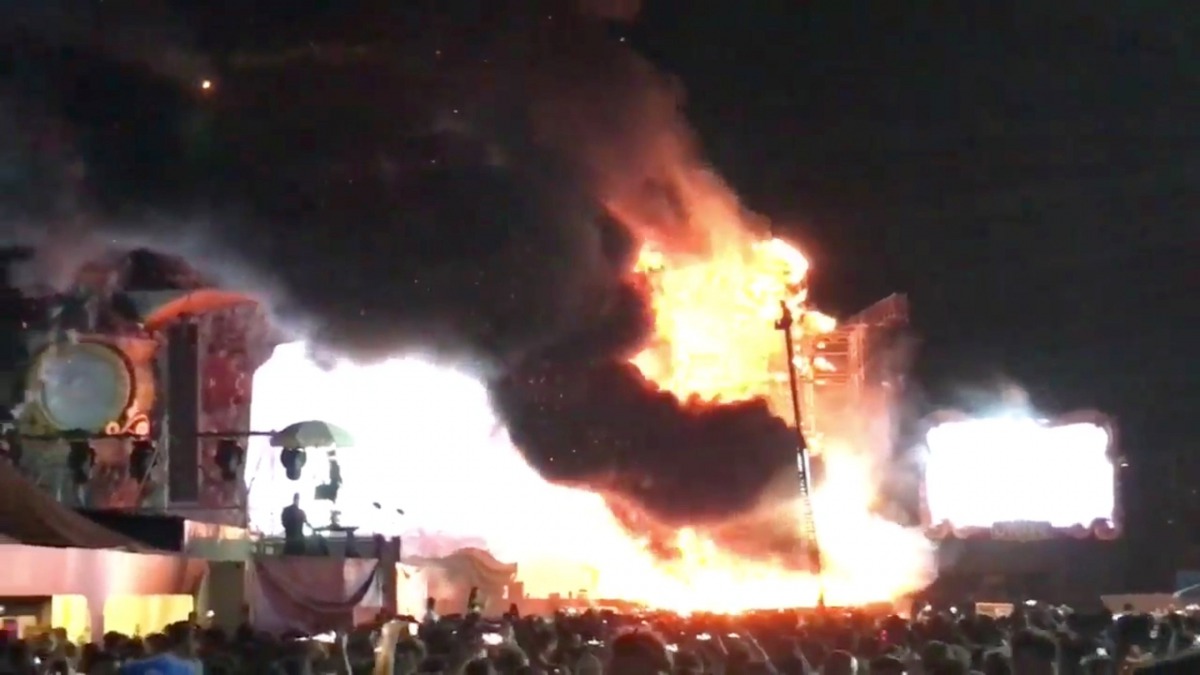Smoke is seen rising from flames engulfing the stage after a fire broke out at Tomorrowland Unite Spain festival in Barcelona, Spain July 29, 2017, in this still image from a video obtained from social media. Alex Prim Lopez via REUTERS 