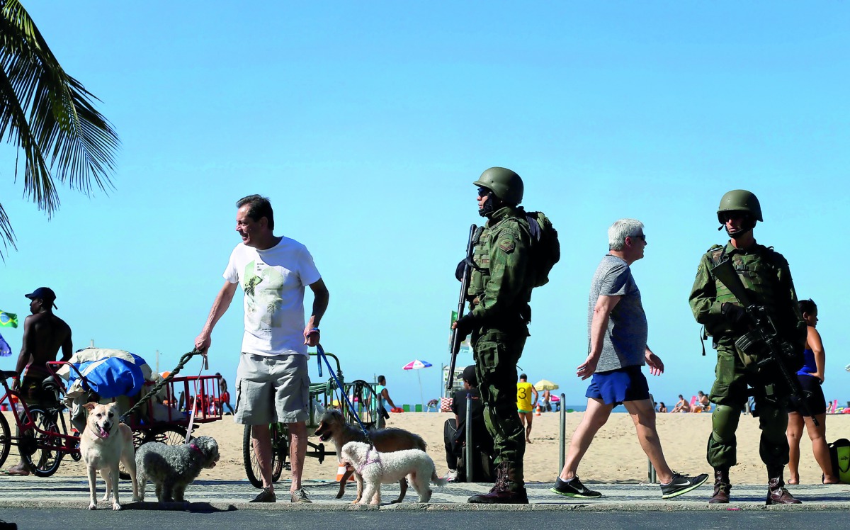 Brazilian navy soldiers patrol the Copacabana beach as part of a plan to combat organized crime in Rio de Janeiro, Brazil July 30, 2017. Brazil has mobilized some 8,500 soldiers to Rio de Janeiro state to fight organized crime and a spike in street violen