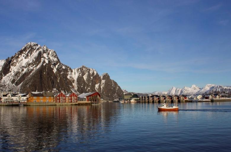 A fishing boat enters the harbour at the Arctic port of Svolvaer in northern Norway March 4,2013. Reuters/Alister Doyle