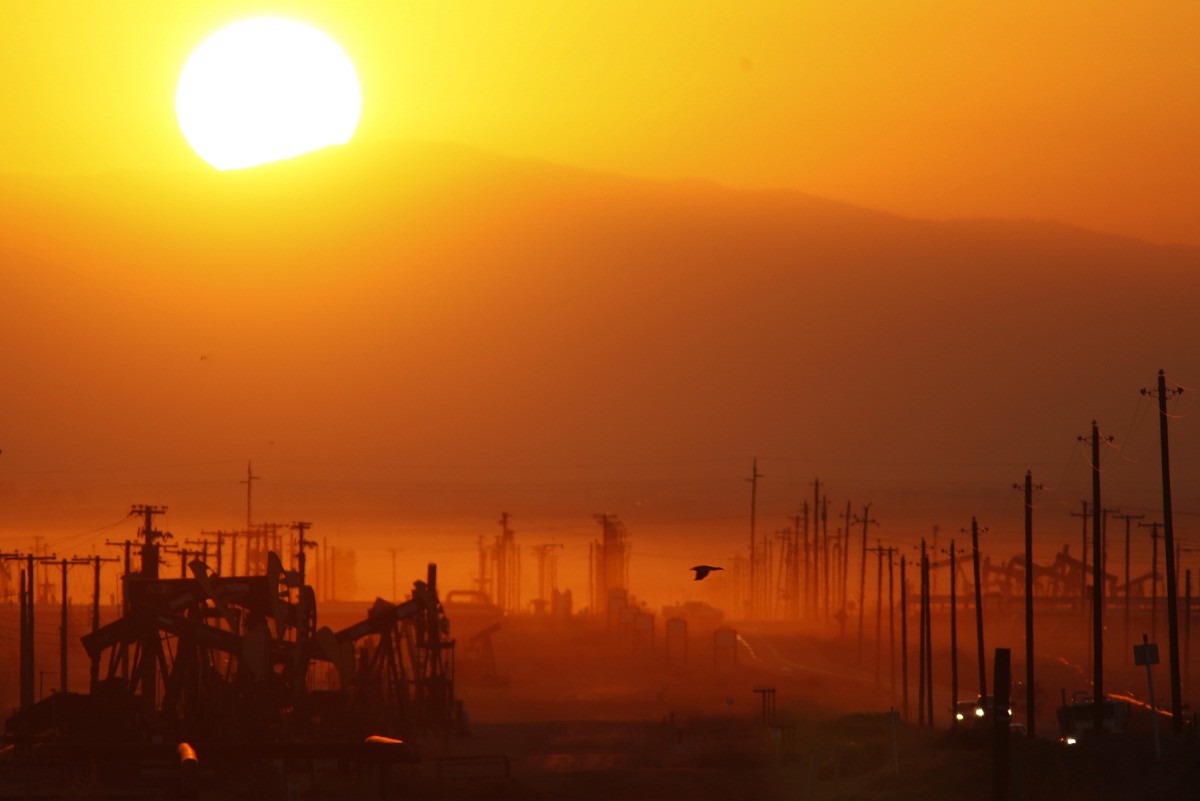 The sun rising over an oil field over the Monterey Shale formation where gas and oil extraction using hydraulic fracturing, or fracking, near Lost Hills, California, on March 23, 2014. AFP / Getty Images North America / David Mcnew 