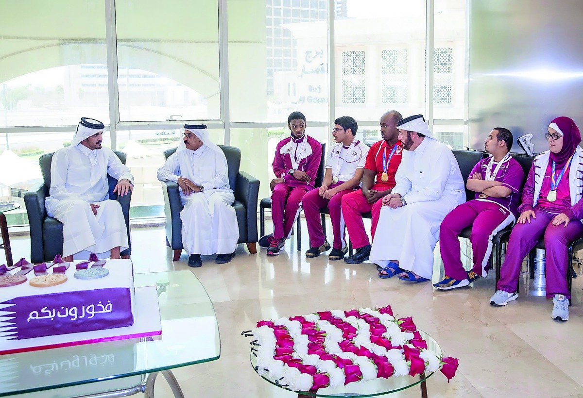 Qatar Olympic Committee President Sheikh Joaan bin Hamad Al Thani speaks with Qatari para-athletes and Qatar Paralympic Committee officials during a felicitation ceremony in Doha yesterday. QOC President Sheikh Joaan honoured the Qatari national para-athl