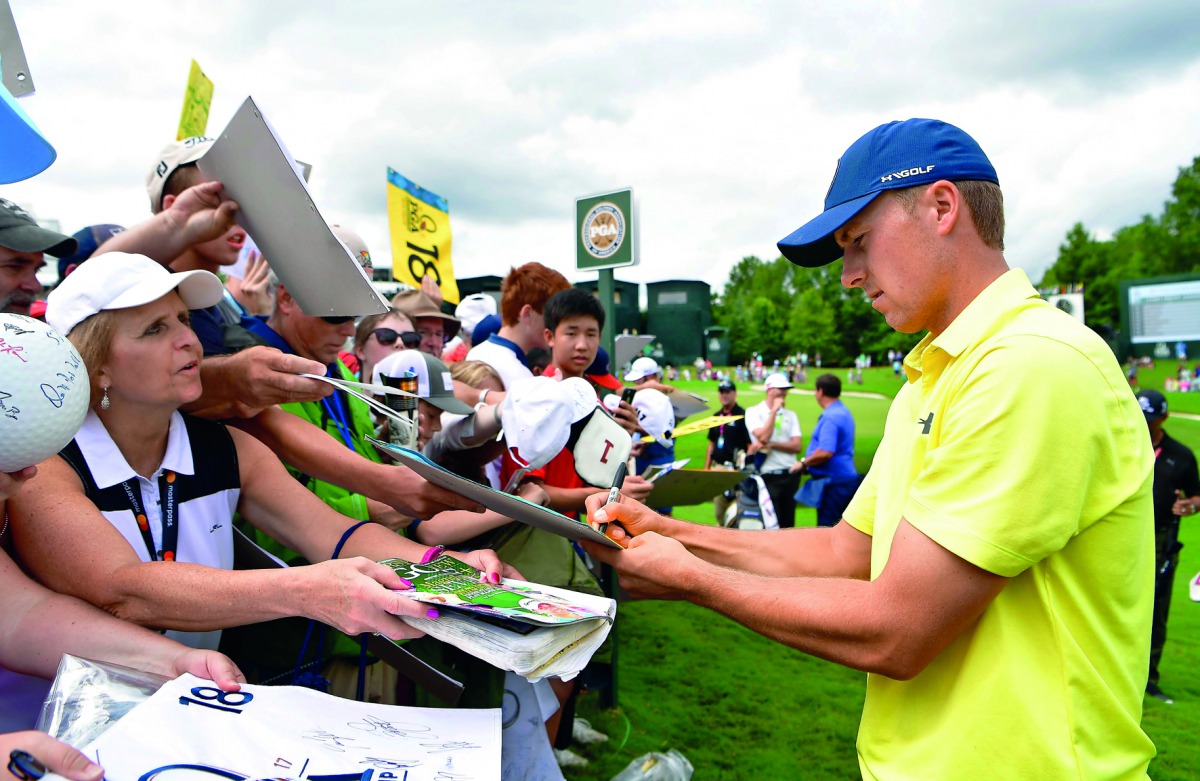 Jordan Spieth of the United States signs autographs for fans during a practice round prior to the 2017 PGA Championship at Quail Hollow Club in Charlotte, North Carolina on Tuesday.