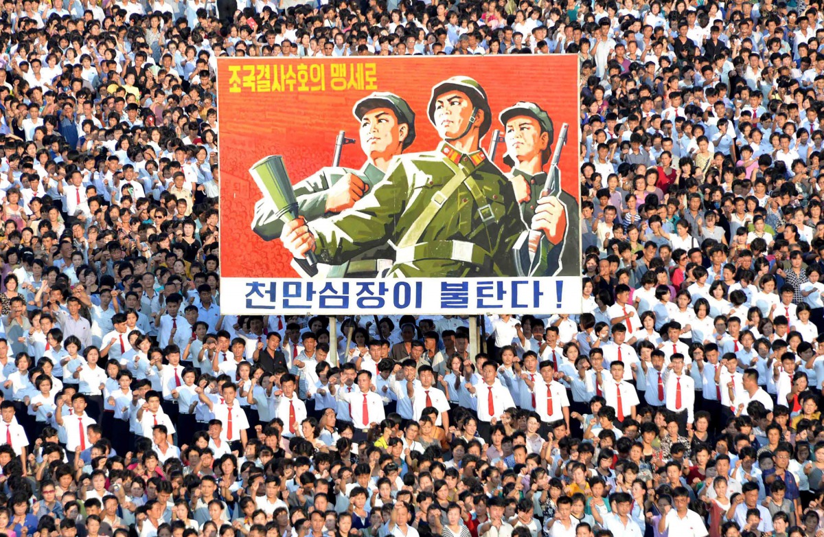 This picture taken on August 9, 2017 and released by North Korea's official Korean Central News Agency (KCNA) on August 10, 2017 shows a rally in support of North Korea's stance against the US, on Kim Il-Sung square in Pyongyang. (AFP PHOTO/KCNA VIA KNS)