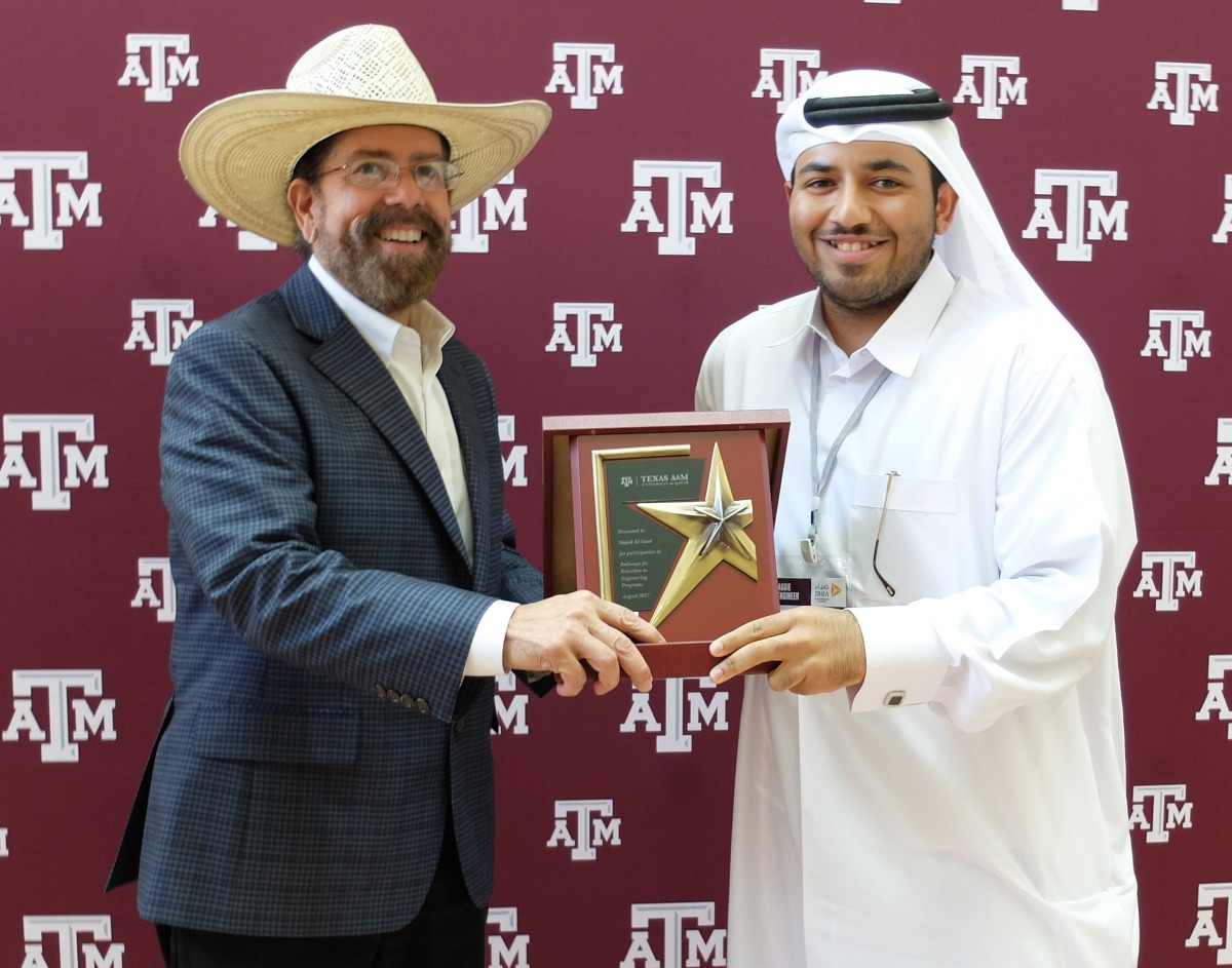 A student receives certificate after PREP training. 