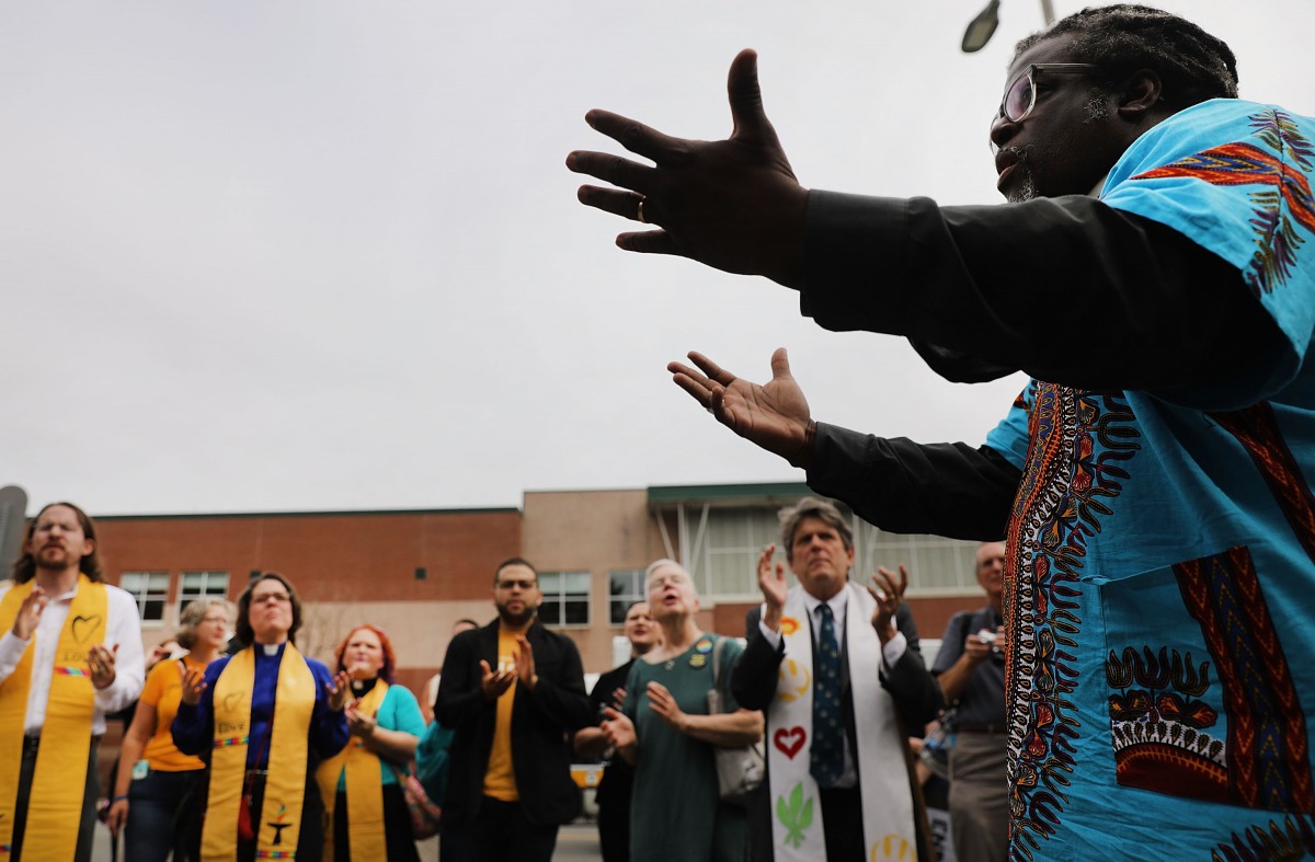Marchers participate in an interfaith prayer service in Boston before marching against a planned 'Free Speech Rally' just one week after the violent 'Unite the Right' rally in Virginia left one woman dead and dozens more injured on August 19, 2017 in Bost