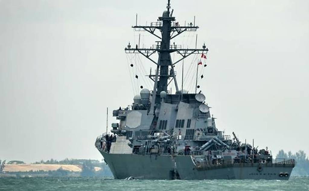 A general view of the USS John S McCain with a hole on its port side, outside Changi naval base in Singapore on Aug 21, 2017. (Photo: AFP/Roslan Rahman).