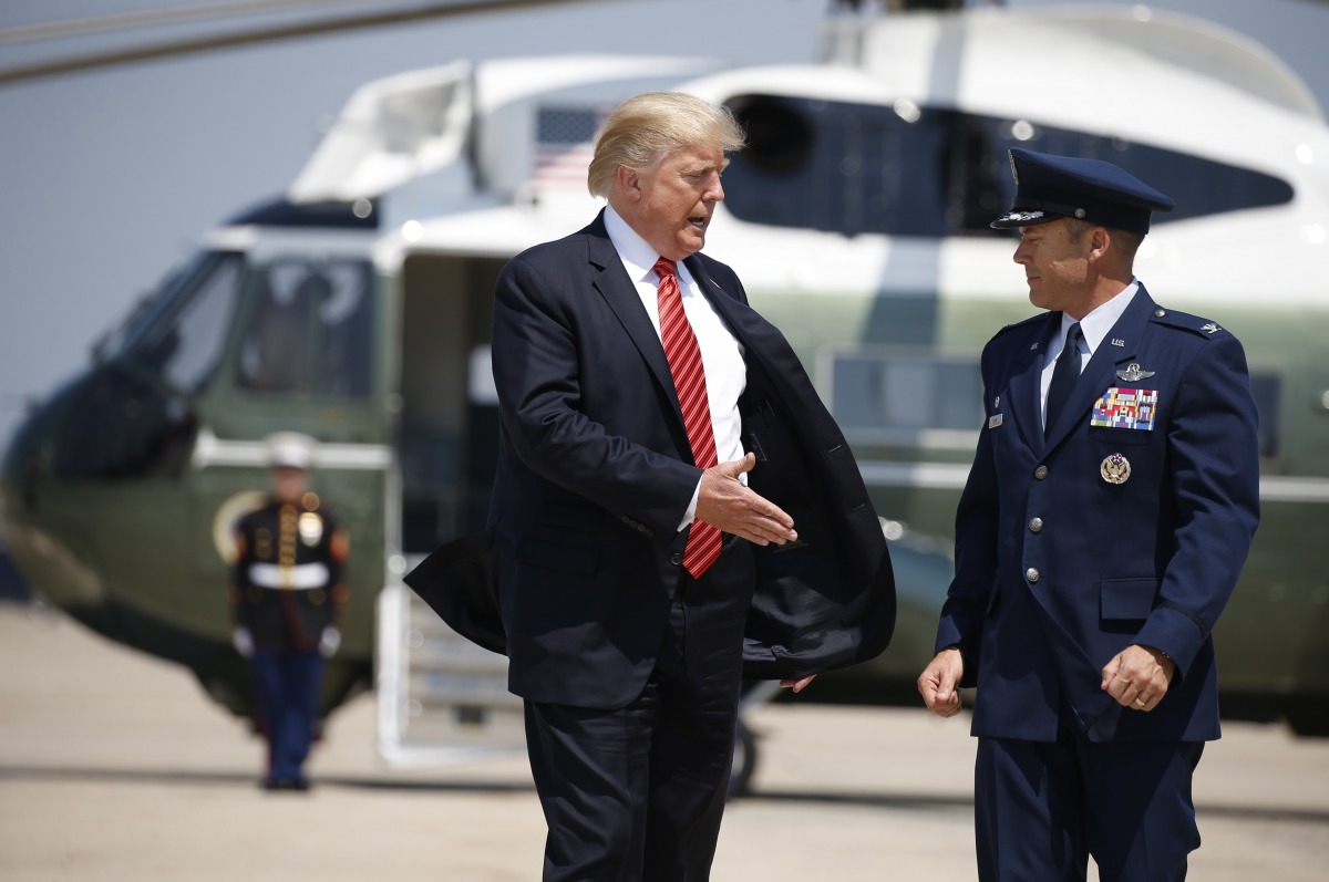 U.S. President Donald Trump is escorted prior to departing for Arizona from Joint Base Andrews, Maryland, U.S., August 22, 2017. Reuters/Joshua Roberts