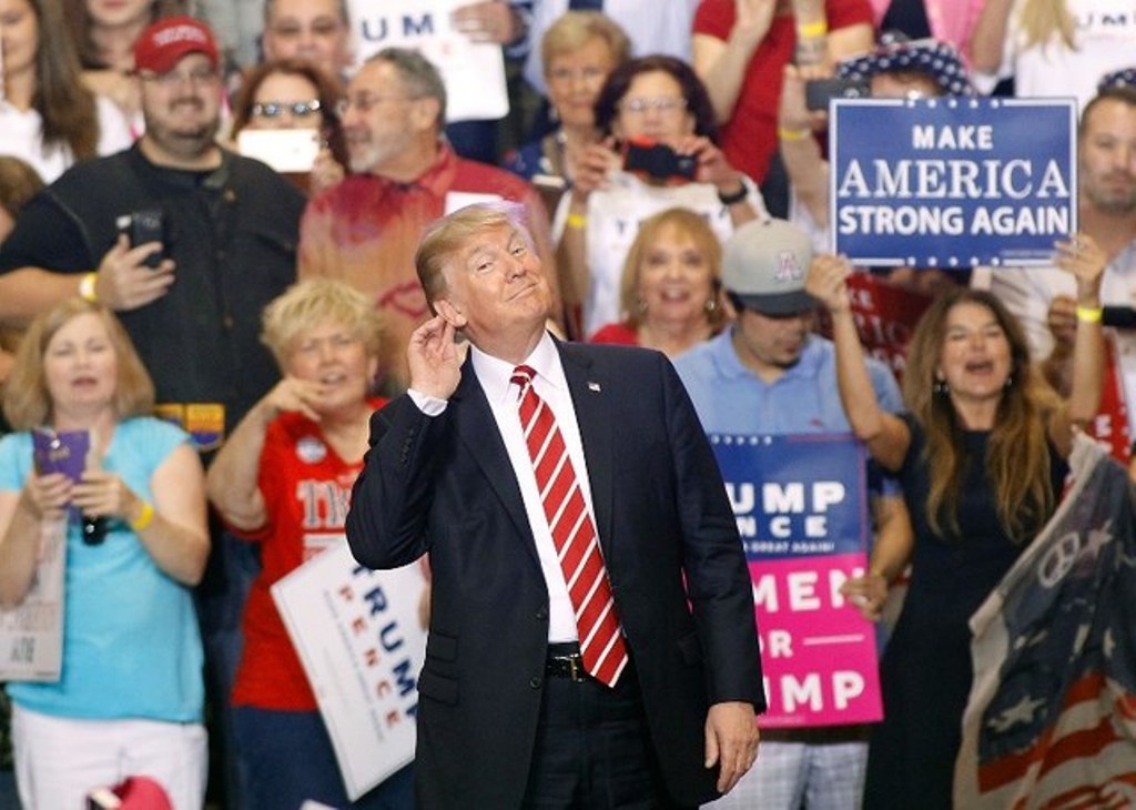 ECHO CHAMBER. U.S. President Donald Trump gestures during a rally at the Phoenix Convention Center on August 22, 2017 in Phoenix, Arizona. Ralph Freso/Getty Images/AFP.