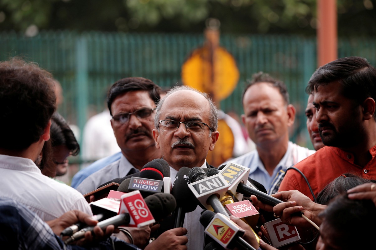 Prashant Bhushan, a senior lawyer, speaks with the media after a verdict on right to privacy outside the Supreme Court in New Delhi, India August 24, 2017. (REUTERS/Adnan Abidi)
