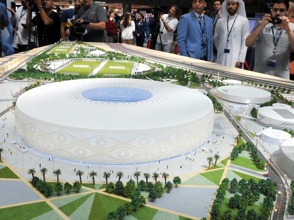 Visitors watch a scale model of Al Thumama Stadium which was unveiled at Hamad International Airport in Doha yesterday. Picture by: Salim Matramkot/The Peninsula.