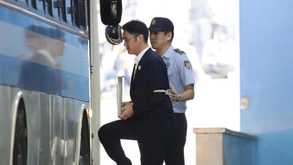 Samsung Group heir Lee Jae-yong leaves court in Seoul after being sentenced to five years in prison. (Chung Sung-jun / AFP).