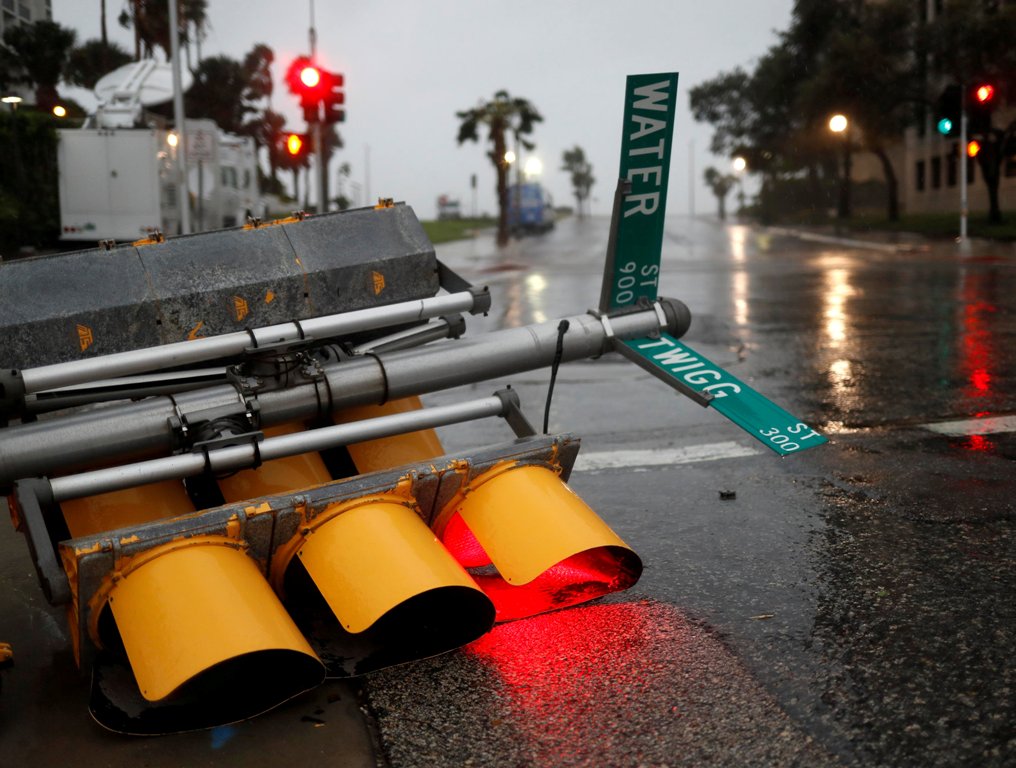 Traffic lights lie on a street after being knocked down, as Hurricane Harvey approaches in Corpus Christi, Texas, U.S. August 25, 2017. REUTERS/Adrees Latif TPX IMAGES OF THE DAY.