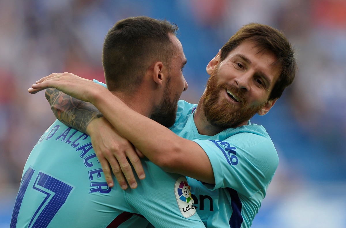 Barcelona’s Lionel Messi celebrates scoring their second goal with Paco Alcacer. (REUTERS/Vincent West)