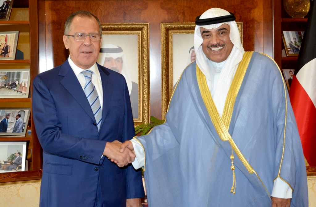 Kuwaiti Foreign Minister, Sheikh Sabah al-Khaled al-Sabah (R) shaking hands with his Russian counterpart Sergey Lavrov following a meeting in Kuwait City. KUNA 
