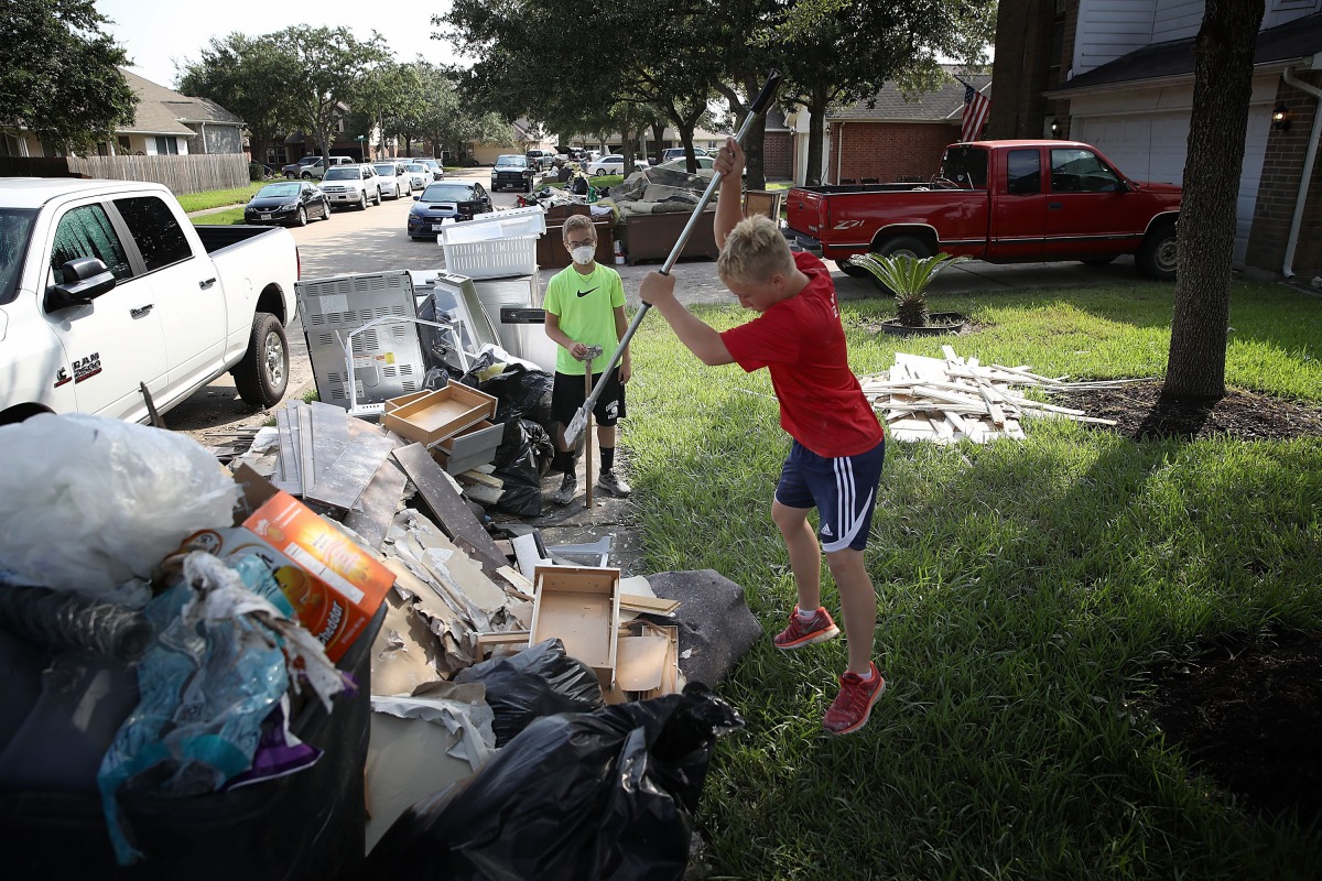 Dickinson residents discard possessions damaged by flooding brought on by Hurricane Harvey September 1, 2017 in Dickinson, Texas. (Win McNamee/Getty Images/AFP)