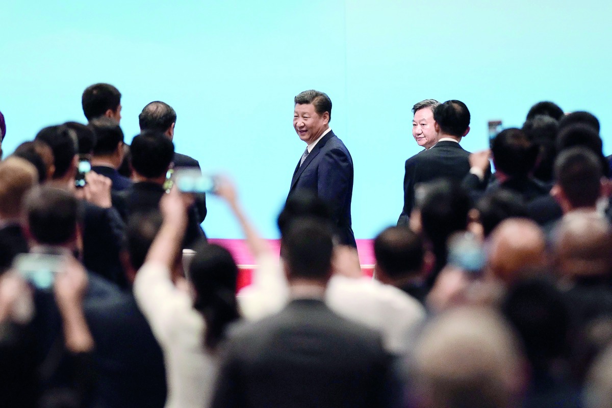 Chinese President Xi Jinping (C) arrives for the opening ceremony of the BRICS Business Forum at the Xiamen International Conference and Exhibition Centre in Xiamen, southeastern China?s Fujian Province, on September 3, 2017. The BRICS Summit, involving B