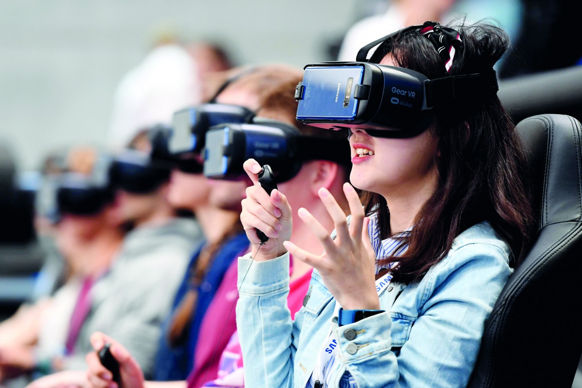 Visitors try out VR glasses at the booth of Samsung at the IFA Consumer Electronics Fair in Berlin on September 2, 2017. The fair is open for the public from September 1 to 6, 2017. AFP / dpa / Maurizio Gambarini