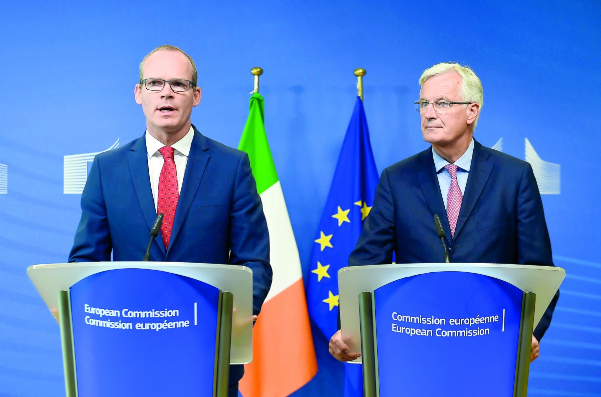Irish Foreign Minister Simon Coveney (L) and EU chief Brexit negotiator Michel Barnier address a joint press conference on the Brexit at the EU headquarters in Brussels on September 4, 2017. The EU's chief Brexit negotiator said on September 4 he did not 