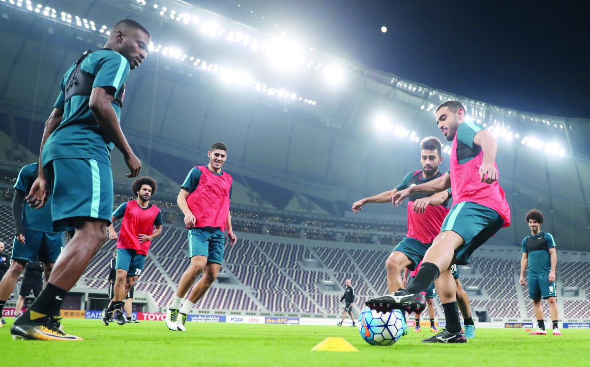 Qatar football players in action during a training session ahead of their final 2018 World Cup qualifier against China at the Khalifa International Stadium in Doha yesterday. Qatar and China will play in their Group A qualifier today at 6.00pm.  Picture: 