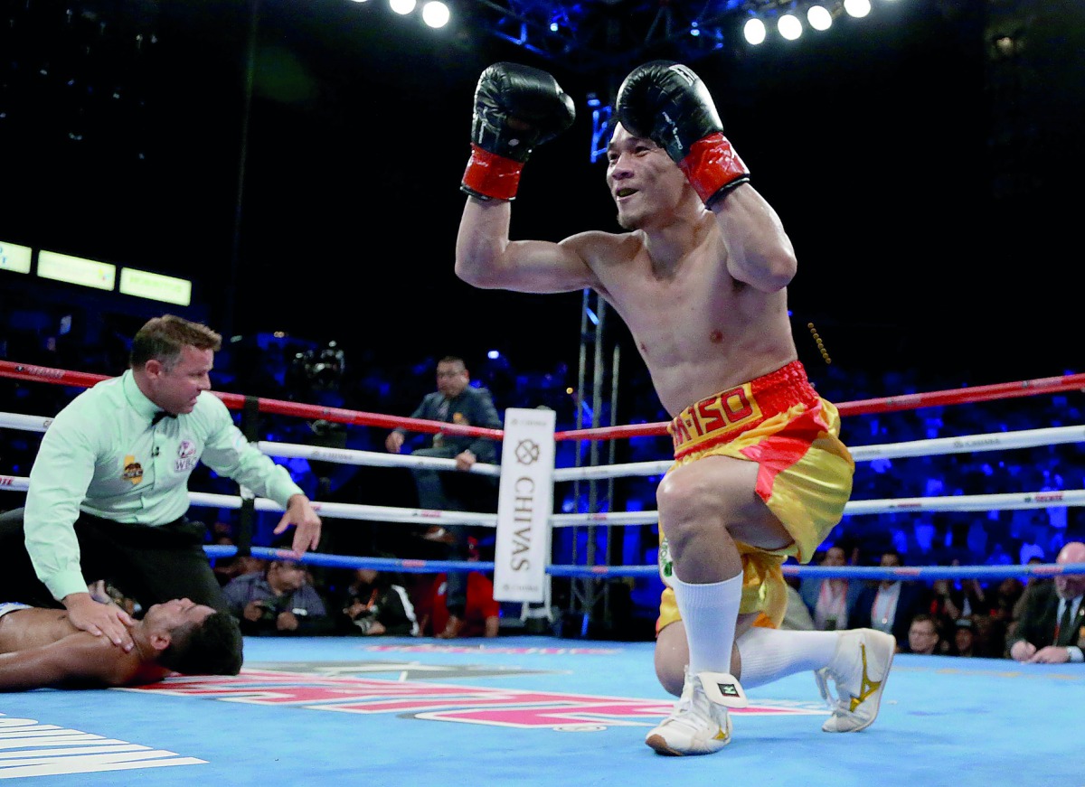 Srisaket Sor Rungvisai of Thailand celebrates as Roman Gonzalez of Nicaragua is knocked out at StubHub Center in Carson, California on Saturday.