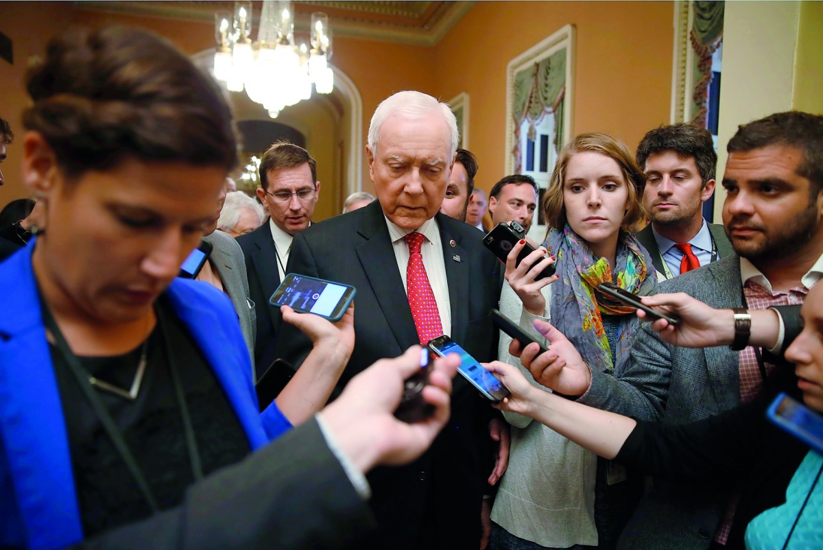 Senate Finance Committee Chairman Orrin Hatch (R-UT) faces reporters following a weekly lunch meeting with fellow Republicans on Capitol Hill in Washington, U.S., September 12, 2017. REUTERS/Joshua Roberts
