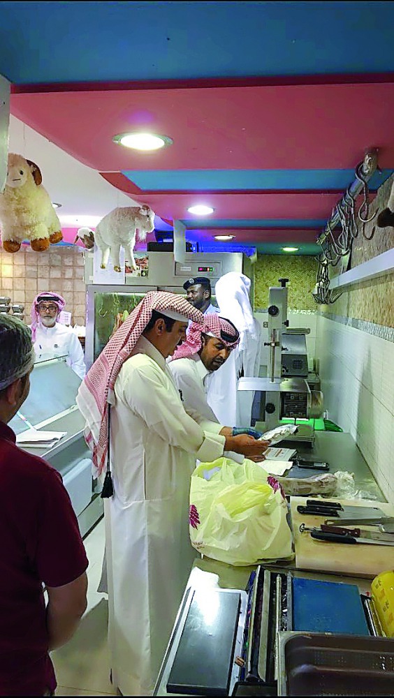 Officials inspecting food items.