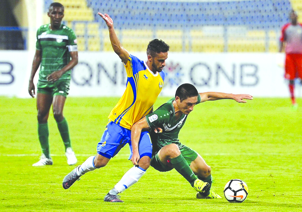 Action during the QNB Stars League match between Al Gharafa SC and Al Ahli at Al Gharafa Stadium yesterday.The match ended in a one-all draw. Picture: Kamutty VP/ The Peninsula