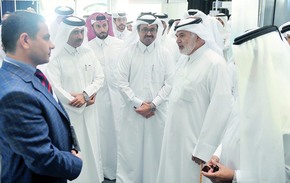 Minister of Energy and Industry, H E Dr Mohammed bin Saleh Al Sada (centre), and other officials during a tour at the exhibition ‘Buy Local Products 3’ to support Qatar Local Manufacturing at DECC yesterday. Pic: Baher Amin / The Peninsula