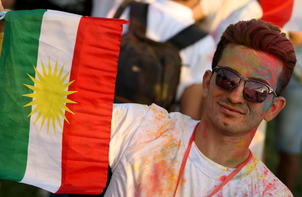 An Iraqi Kurd holds a Kurdish flag during an event to urge people to vote in the upcoming independence referendum in Arbil, the capital of the autonomous Kurdish region of northern Iraq, on September 15, 2017. AFP / SAFIN HAMED
