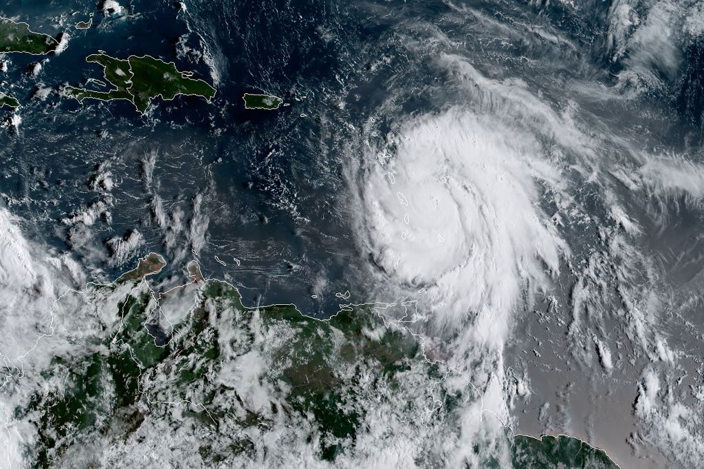 This satellite image obtained from the National Oceanic and Atmospheric Administration (NOAA) shows Hurricane Maria at 1215 UTC on September 18, 2017. AFP / NOAA/RAMMB