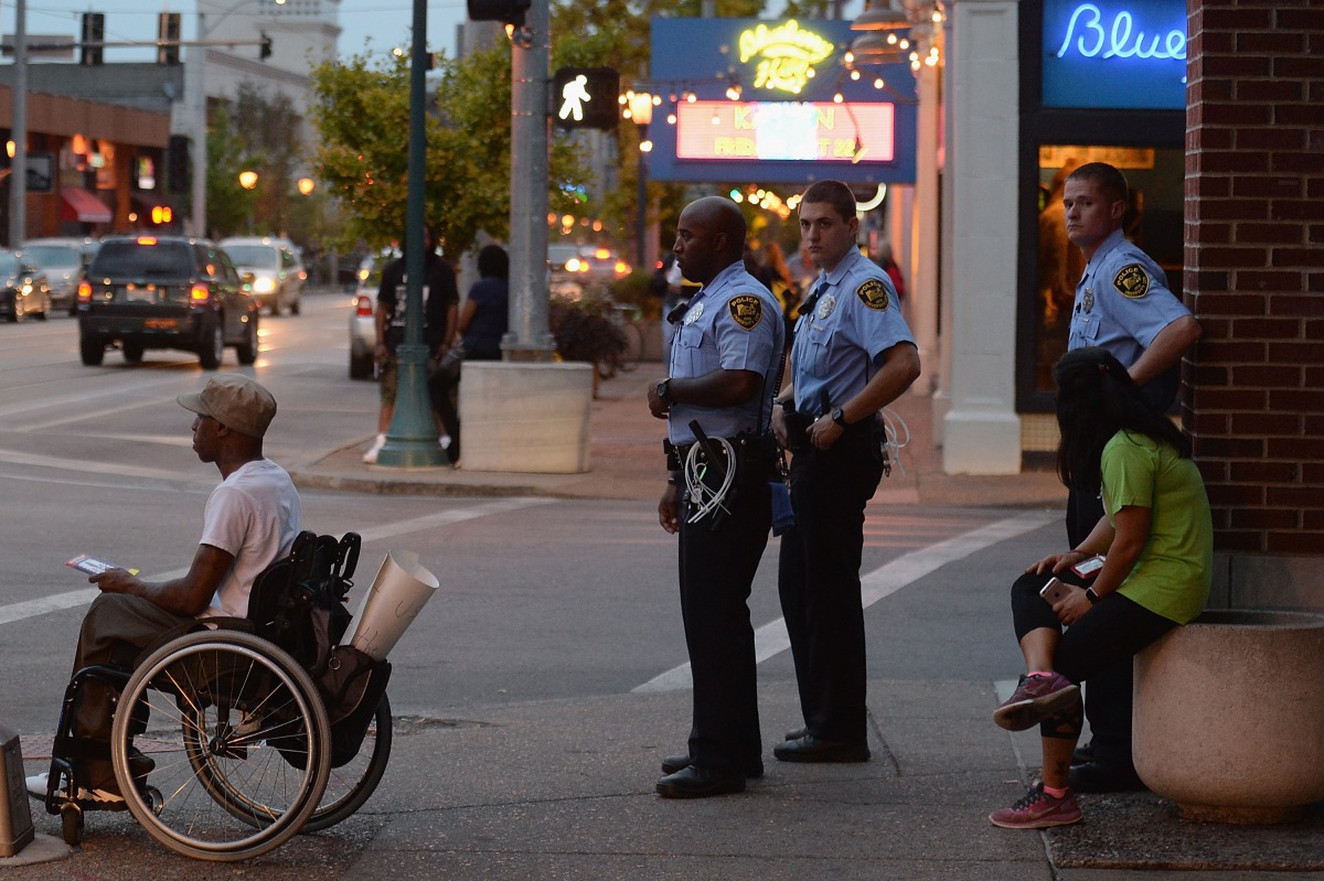University City Police Officers stand outside a local business prior to a protest action following a not guilty verdict on September 18, 2017 in University City, Missouri. Protests have now erupted for a fourth day that have lead to vandalism and damage f