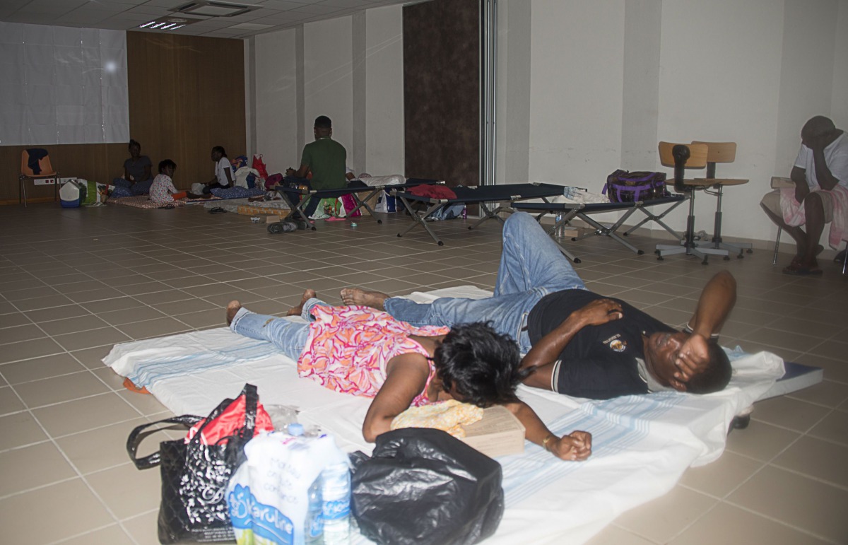 People take refuge in an hurricane shelter on September 19, 2017, in La Savane, on the French Caribbean island of Saint-Martin, after it was hit by Hurricane Irma and as the island prepares to step up its alert level ahead of the arrival of Hurricane Mari