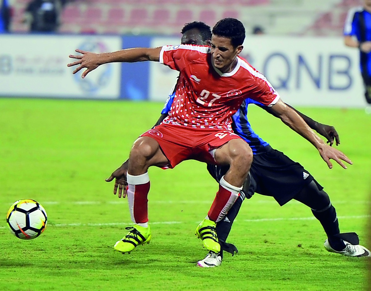 Al Arabi and Al Sailiyah players vie for the ball possession during their opening match of the 2017 QNB Stars League season at Al Arabi Stadium on Saturday.