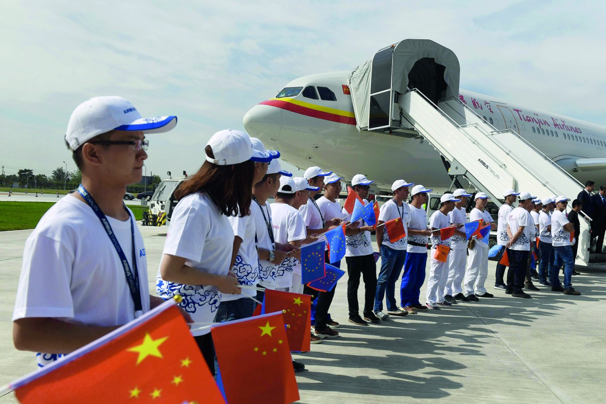 Officials board the first Airbus A330 plane to be delivered during the inauguration ceremony of the Airbus A330 Completion and Delivery Centre in Tianjin, yesterday.