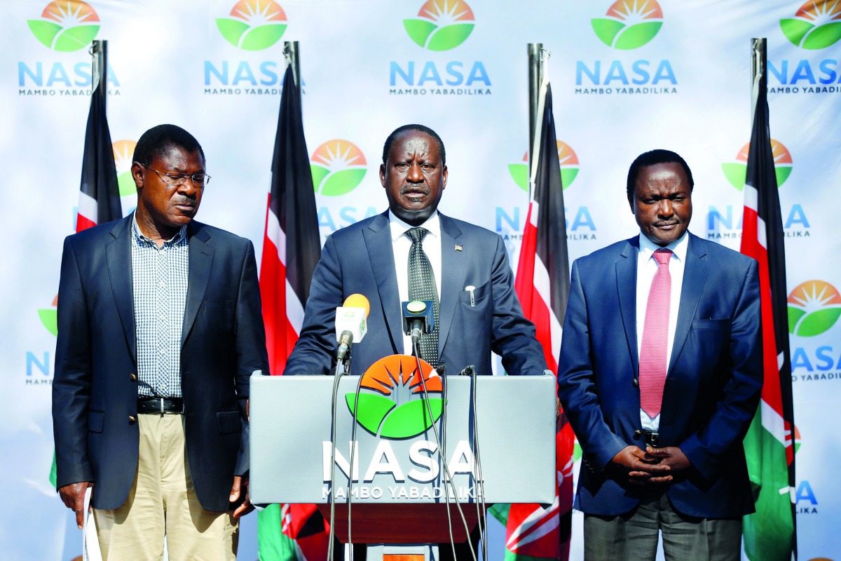 Kenyan opposition leader Raila Odinga (centre), the presidential candidate of the National Super Alliance coalition, and his running-mate Kalonzo Musyoka (right) and Moses Wetangula attend a press conference in Nairobi, yesterday.

