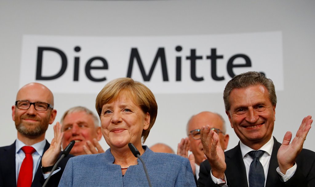 Christian Democratic Union (CDU) party leader and German Chancellor Angela Merkel reacts on first exit polls in the German general election (Bundestagswahl) in Berlin, Germany, September 24, 2017. Reuters/Kai Pfaffenbach