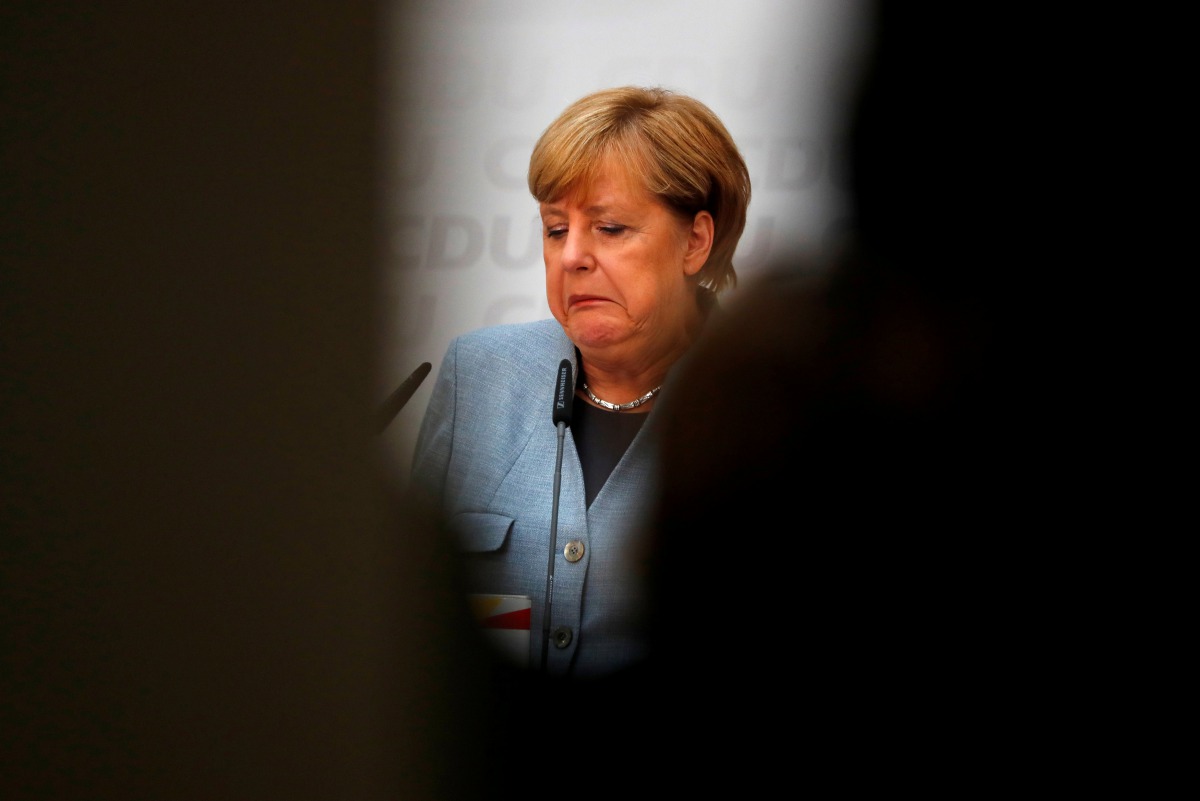 Christian Democratic Union CDU party leader and German Chancellor Angela Merkel reacts during a news conference at the CDU party headquarters, a day after the general election (Bundestagswahl) in Berlin, Germany September 25, 2017. Reuters/Fabrizio Bensch
