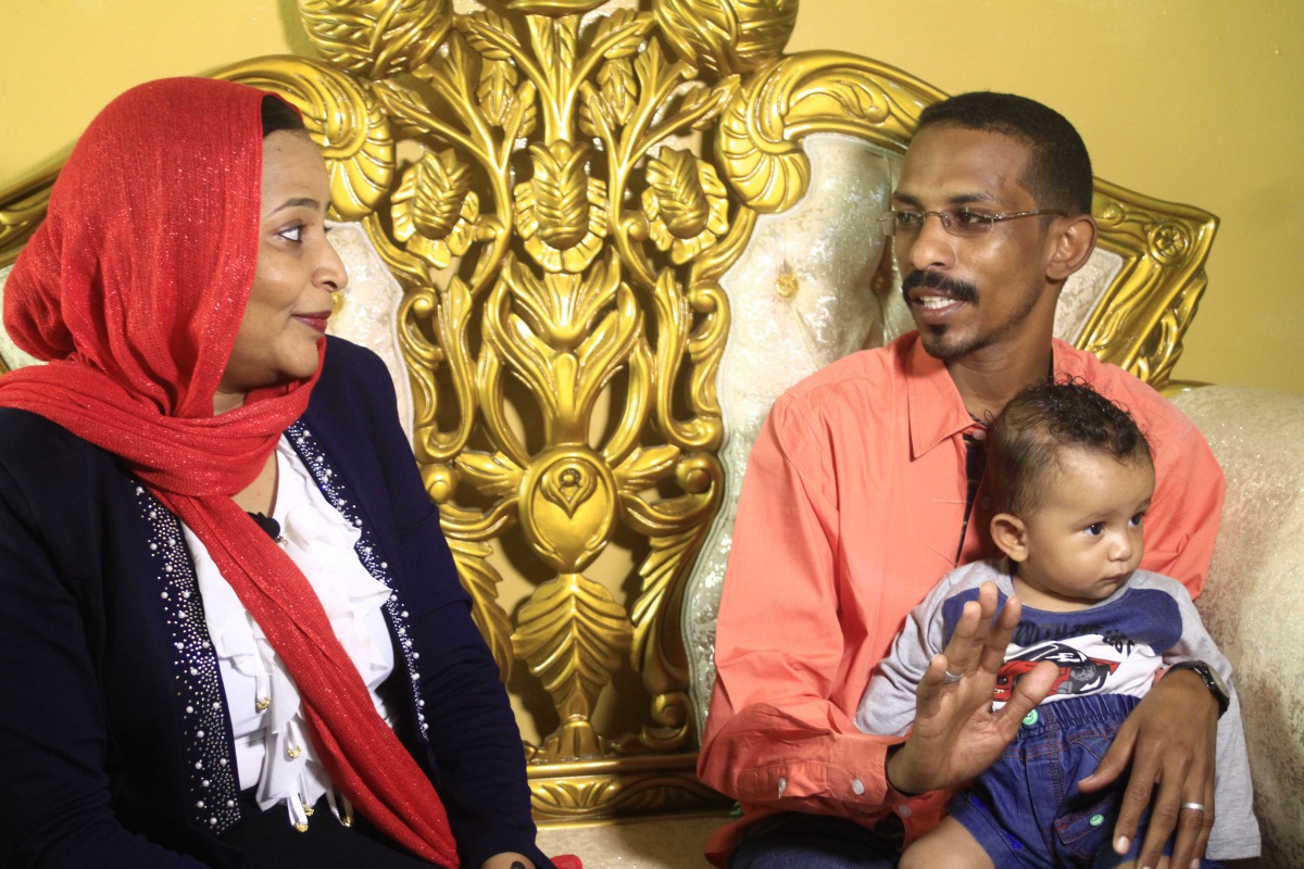 FILE PHOTO: Mohamed al-Khatim, his wife Samah al-Amin and their eight month old son, a Sudanese family emigrating to the US, are seen in Khartoum on February 10, 2017. (AFP / Ebrahim Hamid) 