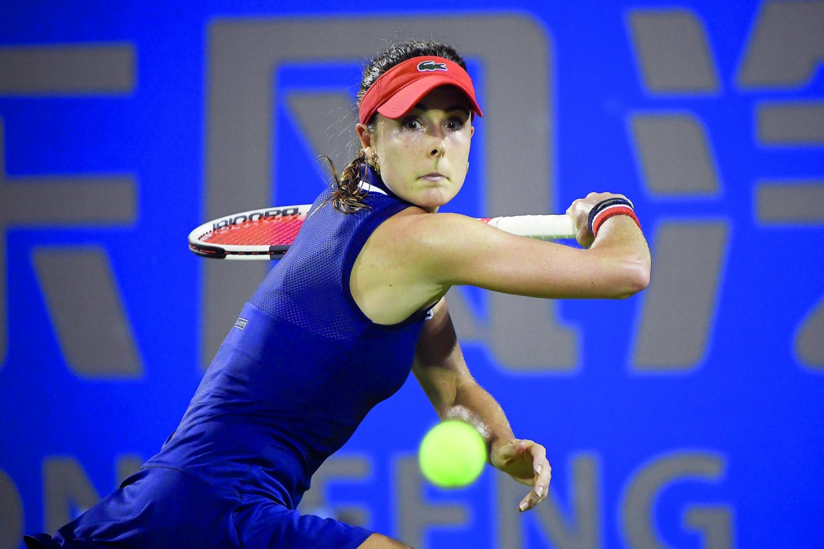 Alize Cornet of France hits a return against Anastasia Pavlyuchenkova of Russia during their first round women’s match at the WTA Wuhan Open tennis tournament in Wuhan, in China’s central Hubei province, yesterday.