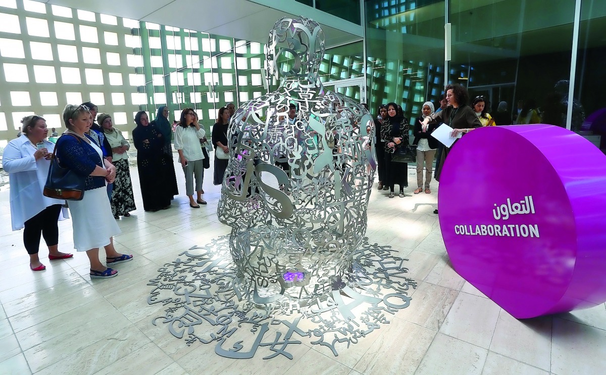 Community members enjoy a guided Art Trail tour in Education City.
