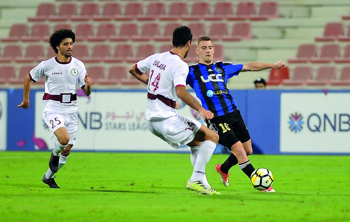 Al Markhiya’s Rebin Ghareeb Solaka (left) and Al Sailiya’s Temurkhuja Abdukholikov vie for the ball possession during their QNB Stars League (QSL) match at Al Arabi Stadium yesterday. Pic: Abdul Basit/The Peninsula