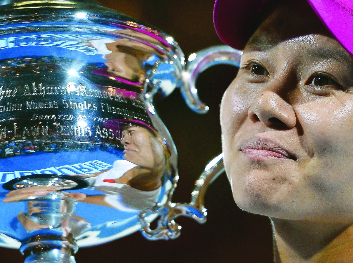 China’s Li Na poses with the trophy after her victory against Slovakia’s Dominika Cibulkova in Australian Open final in Melbourne, in this January 25, 2014 file photo.