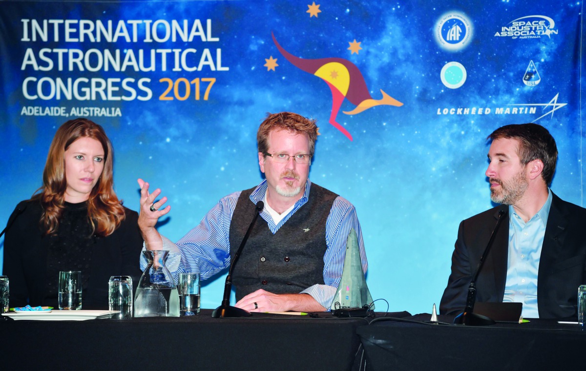 Lockheed Martin's human spaceflight strategy chief Rob Chambers (C), system architect Tim Cichan (R) and systems engineer Danielle Ritchey (L) attend a press conference after a presentation of a planned mission to Mars at the 68th International Astronauti