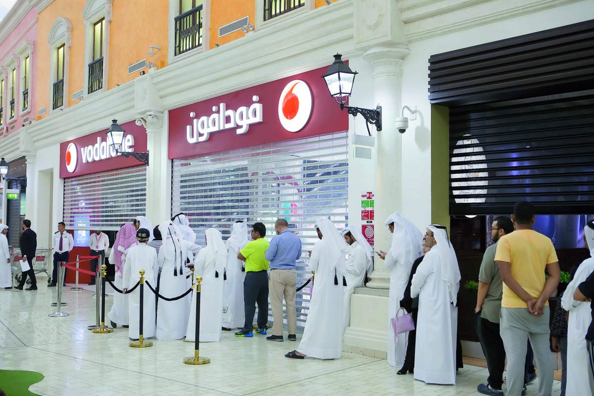 Customers at a Vodafone outlet for the iPhone 8 and iPhone 8 Plus phones.