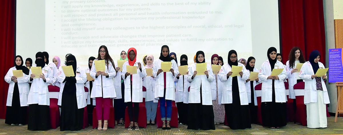 Students of QU-CPH take oath during the 11th annual White Coat Ceremony. 