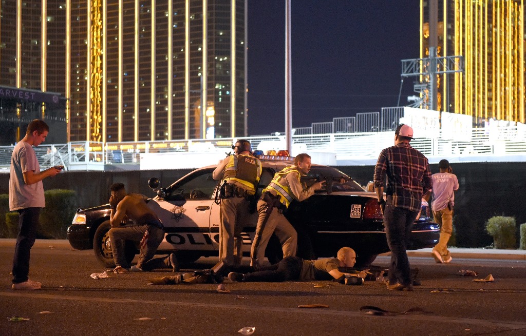 Las Vegas police stand guard along the streets outside the the Route 91 Harvest country music festival grounds after a active shooter was reported on October 1, 2017 in Las Vegas, Nevada. There are reports of an active shooter around the Mandalay Bay Reso