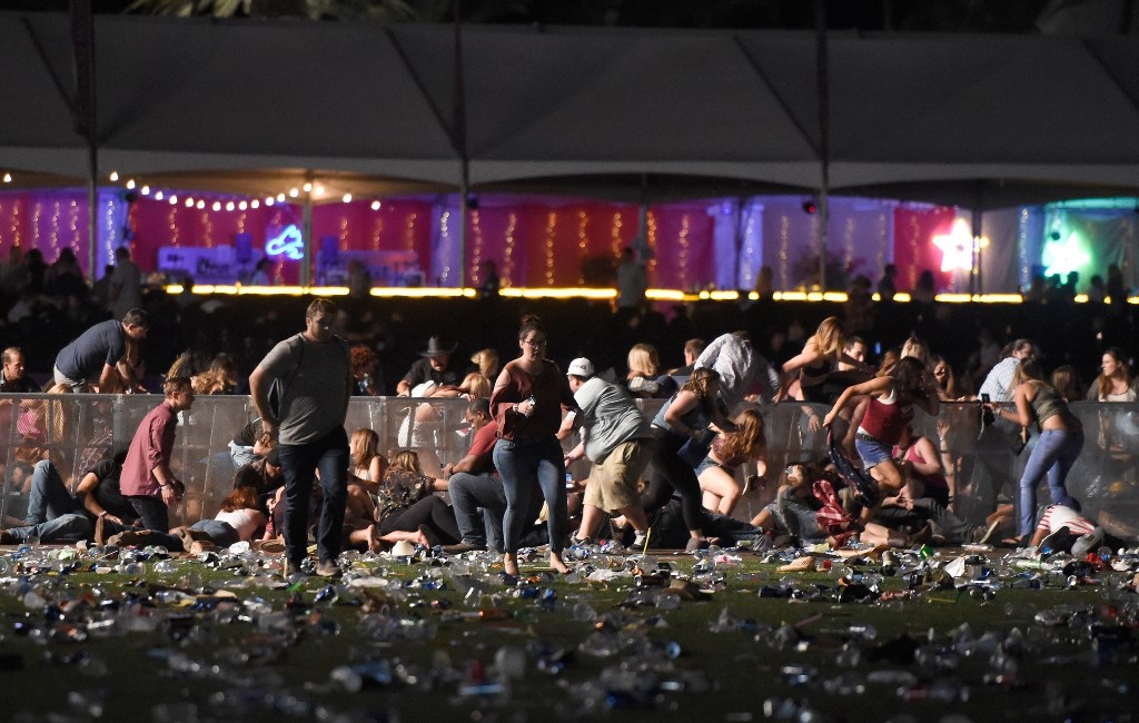 LAS VEGAS, NV - OCTOBER 01 People run from the Route 91 Harvest country music festival after apparent gun fire was heard on October 1, 2017 in Las Vegas, Nevada. There are reports of an active shooter around the Mandalay Bay Resort and Casino. David Becke