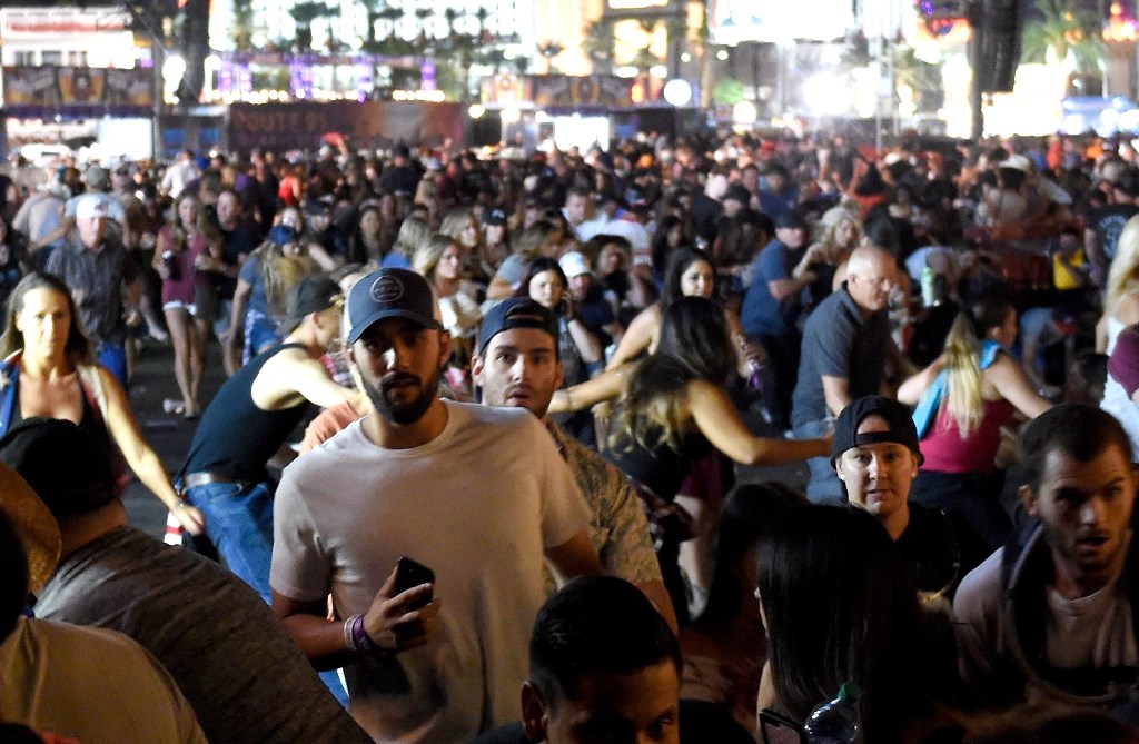 People flee the Route 91 Harvest country music festival grounds after a active shooter was reported on October 1, 2017 in Las Vegas, Nevada. David Becker/Getty Images/AFP