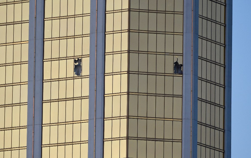 Broken windows are seen on the 32nd floor of the Mandalay Bay Resort and Casino after a lone gunman opened fired on the Route 91 Harvest country music festival on October 2, 2017 in Las Vegas, Nevada. David Becker/AFP

